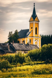 Fields and village panorama with church in a landscape, Somogyvamos