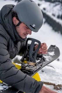 Ski tourers, man assembles his splitboard
