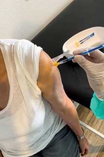 Elderly woman receives injection with medical syringe fourth vaccination booster vaccination against coronavirus disease Covid-19 C19 corona virus Corona virus, Germany