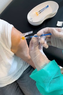 Elderly woman receives injection with medical syringe fourth vaccination booster vaccination against coronavirus disease Covid-19 C19 corona virus Corona virus, Germany