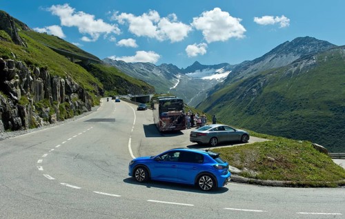 Rest area with coach and cars on the pass road to the Furka Pass, Gletsch
