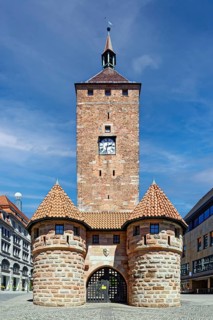 White tower with barbican, tower clock