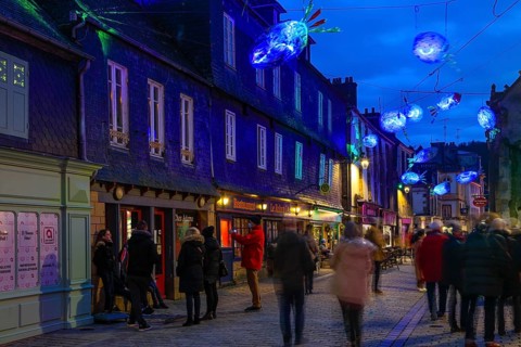 Coloured light installations at Christmas time on the Pont de Rohan bridge over the river Elorn, Landerneau