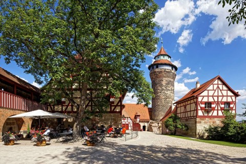 Outer castle courtyard, lime tree in front