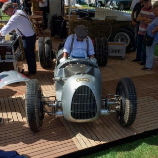 Car mechanic from Audi Tradition prepares historic racing car from Auto Union for car racing show at Classic Days, Schloss Dyck