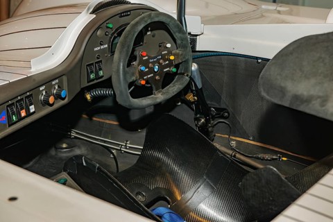 View into cockpit of historic racing car BMW V12 LMR Le Mans for 24h 24 hours race in 90s 1999 with dashboard modern steering wheel racing steering wheel, Messe Techno Classica