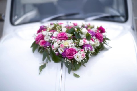 Flower heart, flower decoration on decorated wedding car