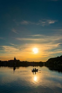 Rowing boat at sunset on the Ziegelsee, Moelln