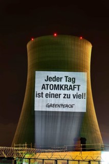 Every day of nuclear power is one too many: Greenpeace projection at the Philippsburg nuclear power plant. Philippsburg, Baden-Wuerttemberg