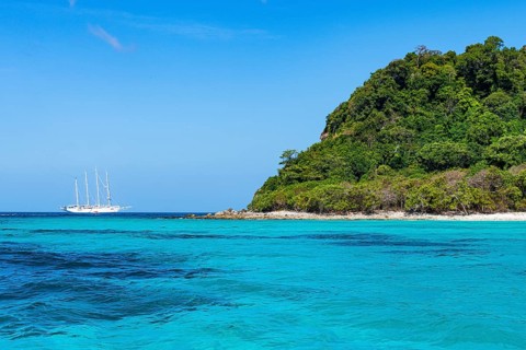 Sailing boat in the waters of Koh Rok, Mu Ko Lanta National Park