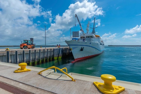 Excursion ship, containers being unloaded by crane