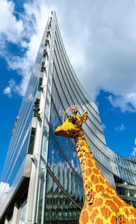 Giraffe made of Lego bricks in front of the entrance to Legoland at the Sony Center, Potsdamer Platz