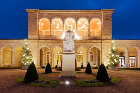 Christmas illuminated arcade building at dusk, Rossini Hall