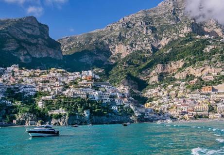 Village view from the sea with the mountain backdrop, Positano
