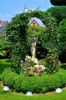 Garden figure : Woman figure in the garden by the ivy