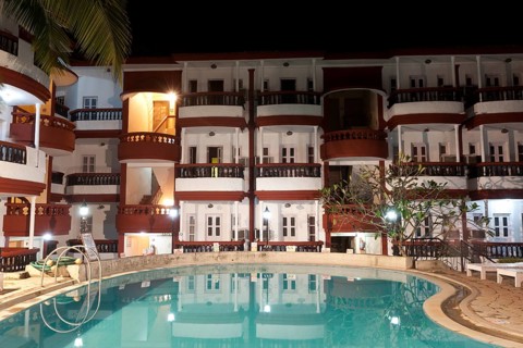 Pool in luxury resort hotel at night. Goa