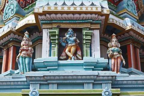 Krishna image. Sculptures on Hindu temple gopura