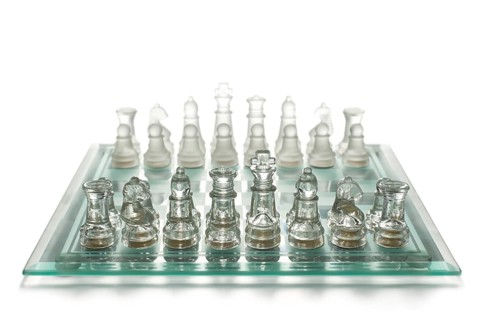 Glass chess on chess board