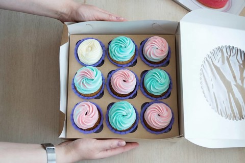 Flatlay cupcake box on the table