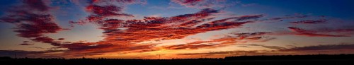 Sunset with red coloured clouds on the evening of the solstice