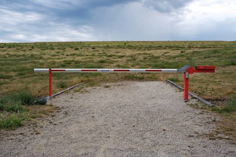 A barrier prevents people from entering a landfill site
