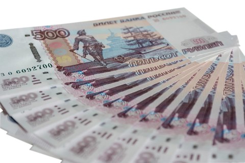 A fan of banknotes of Bank of Russia isolated on white background