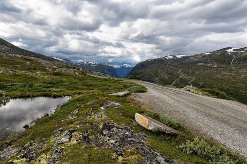 Gravel road through barren mountain landscape