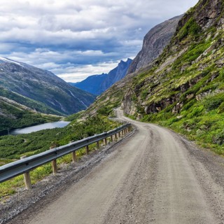 Gravel road through typical mountain landscape