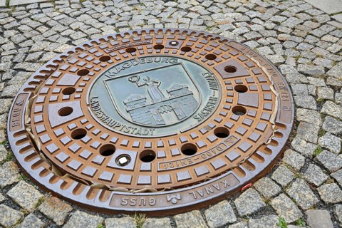 Manhole cover of Magdeburg with coat of arms of the city