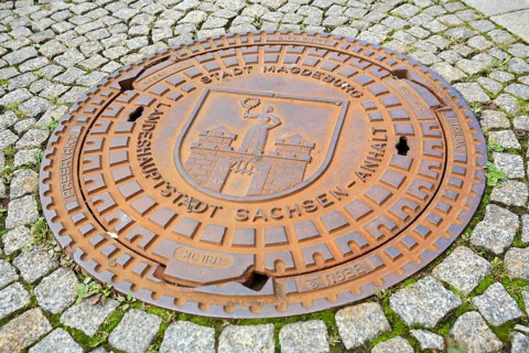 Manhole cover of Magdeburg with coat of arms of the city