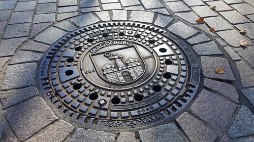 Manhole cover of Magdeburg with coat of arms of the city