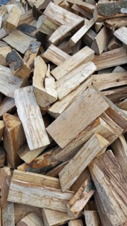 Delivery of firewood in the pile. Split and dried ready for the stove