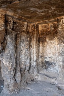 Views of the underground chamber located below the temple of Sin and containing bas-relief representations of the Syrian Gods amidst representations of the lunar crescent in Sogmatar