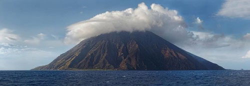 Stromboli volcano and island with bizarre cloudscape