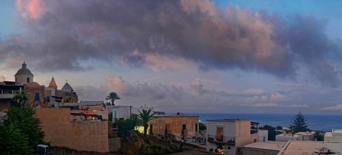 San Vincenzo island village and Stromboli volcano at sunset
