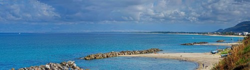 Sandy beach beach with turquoise sea at the Grotte Piedigrotta
