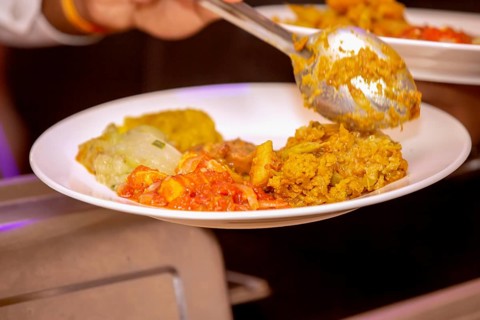 Serving freshly homemade curry of pumpkin