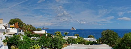 Town of Panarea overlooking the small island of Le Guglie and di Basiluzzo of a former volcano