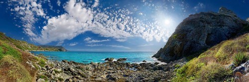 Bay Capo Vaticano with turquoise sea and bizarre sky