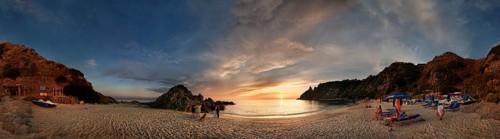 Panorama on the sandy beach and bay Capo Vaticano at sunset