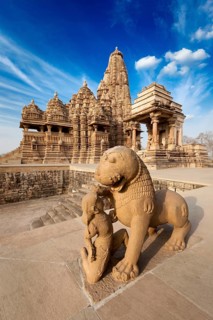 King and lion fight statue and Kandariya Mahadev temple. Khajuraho