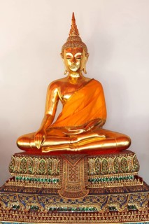 Sitting Buddha Gold Statue close up in Buddhist Temple. Wat Pho