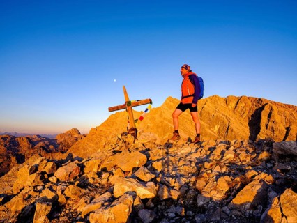 Mountaineers on the summit of the Kleiner Watzmann in the morning light
