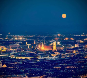 Vintage retro hipster style travel image of night aerial view of Munich from Olympiaturm