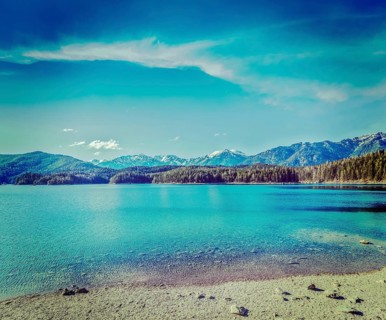 Vintage retro hipster style travel image of Eibsee lake. Bavaria