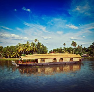 Vintage retro hipster style travel image of Kerala travel tourism background