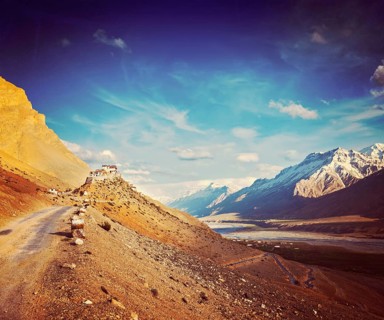 Vintage retro hipster style travel image of road to Kee