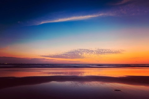 Vintage retro hipster style travel image of sunset on Baga beach. Goa