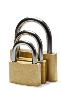 Three padlocks of different size isolated on white