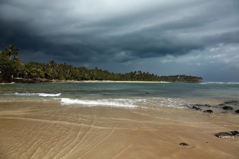 Beach and gathering storm. Mirirssa
